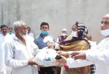 Photo of Lakshmipur MP couple next to people with humanitarian services